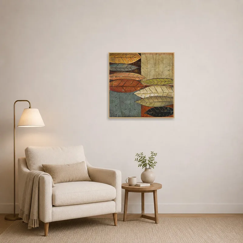 Reading corner adorned with textured autumn leaves art for a cozy feel.