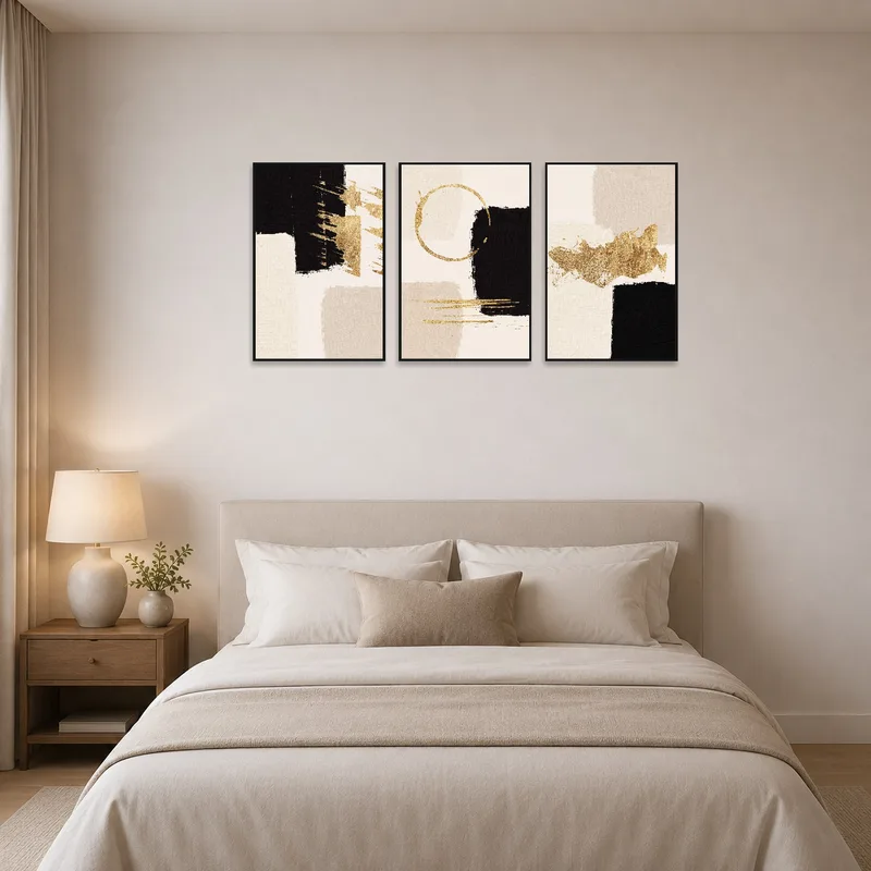 Abstract triptych as a focal point above the bed in a stylish bedroom.