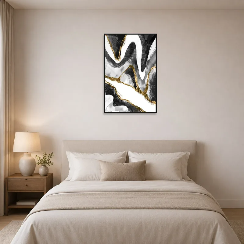 Abstract black and gold wave art print adding elegance to a bedroom environment.