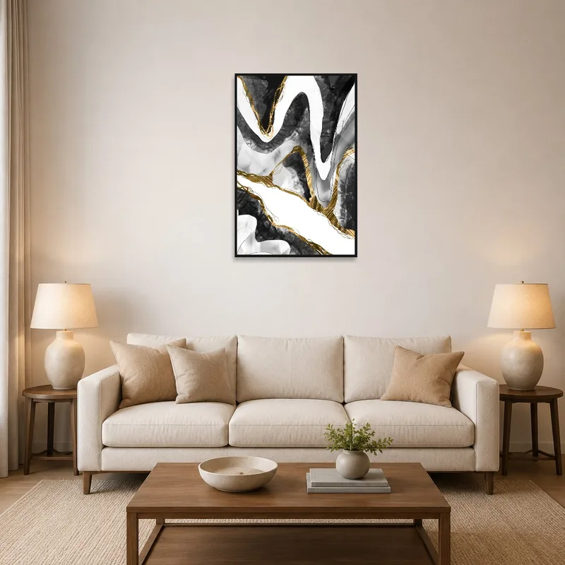 Abstract black and gold wave art print above a stylish sofa in a living room.