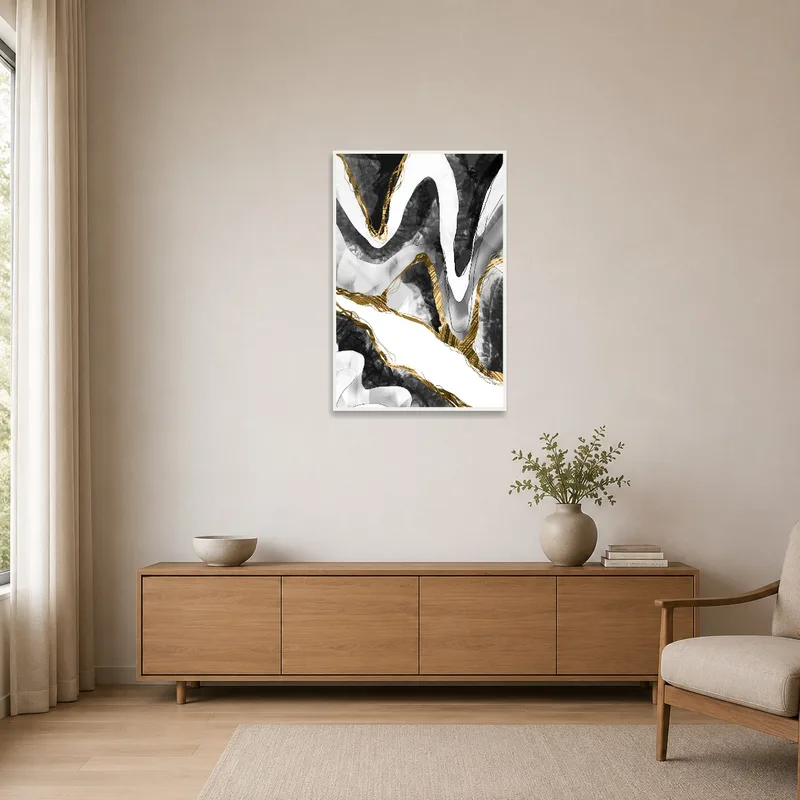 Abstract black and gold wave art print in a minimalist room with sleek furniture.