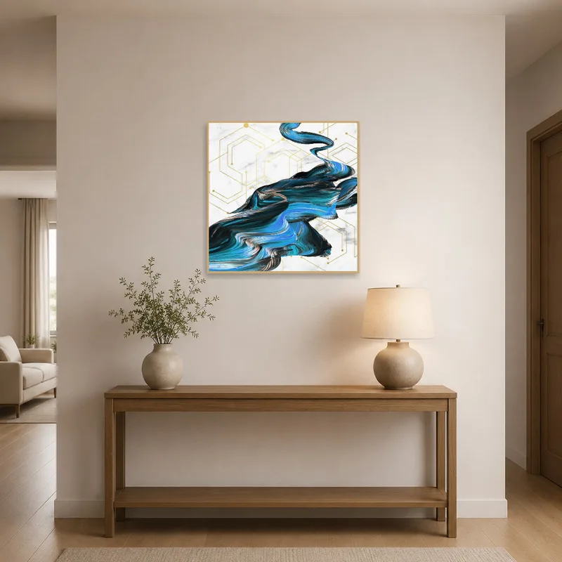 Entrance hall adorned with abstract blue and gold swirl art, adding elegance.