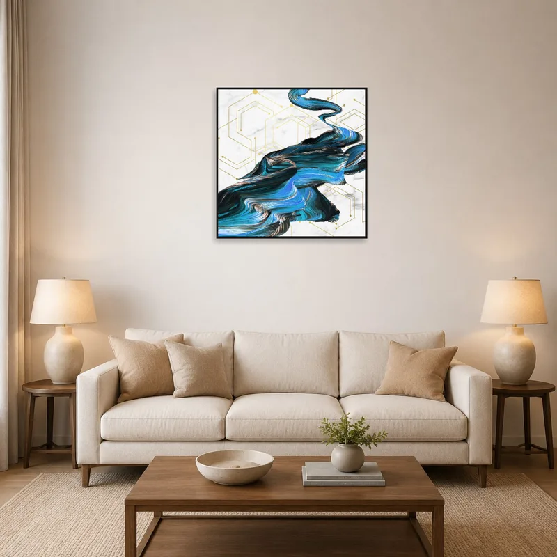 Abstract blue and gold swirl art on living room wall above a modern sofa.