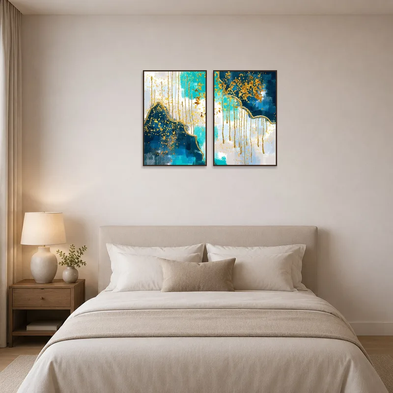 Elegant abstract blue and gold splatter set above the headboard in a bedroom.