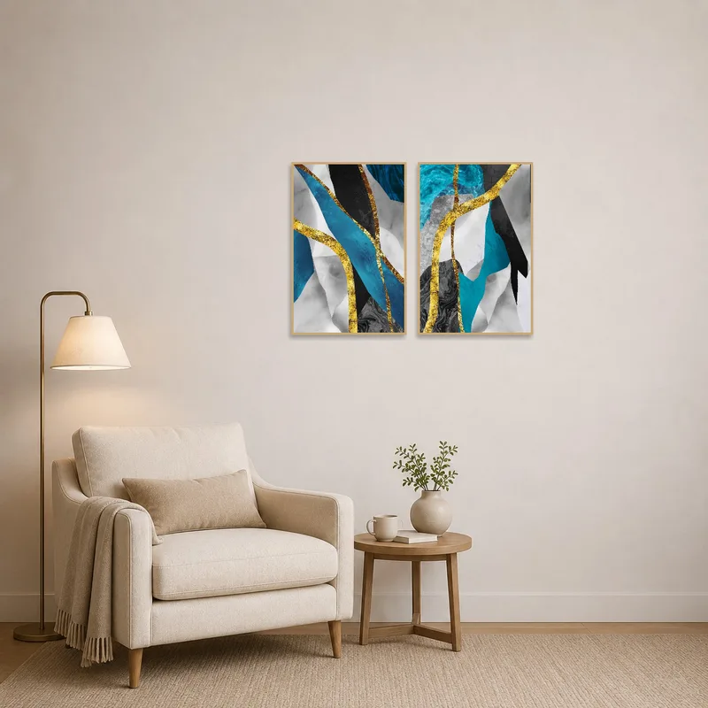 Reading corner with a cozy chair and abstract blue and gold art set on the wall.