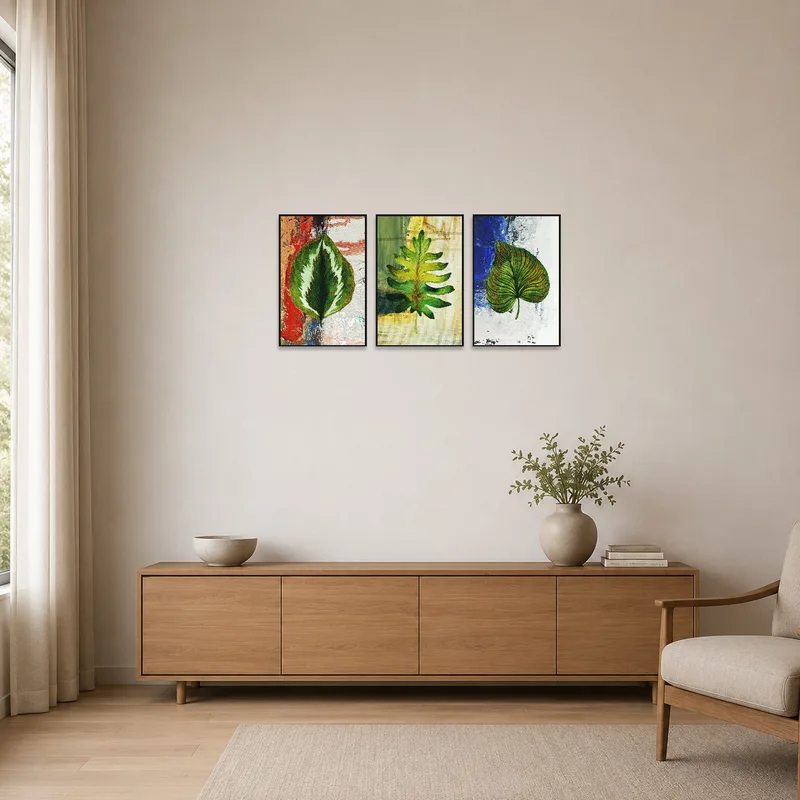 Abstract botanical triptych displayed in a minimalist room with sleek furnishings.