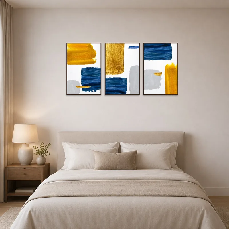 A serene bedroom features abstract blue and gold brushstrokes above the bed.