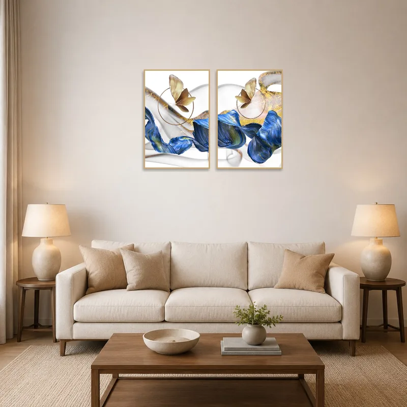 Abstract butterfly and waves art on a living room wall above a modern sofa.