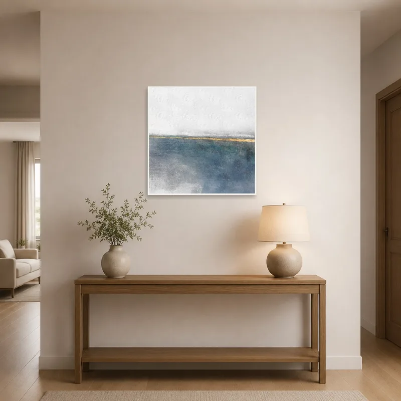 Artistic coastal print welcomes guests in an entrance hall.