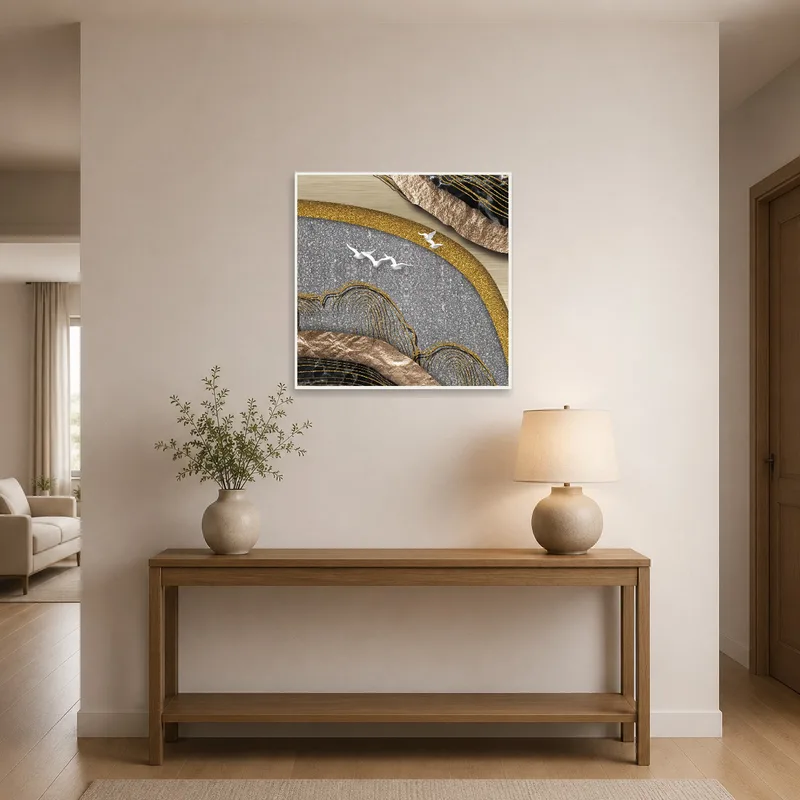Metallic abstract art brightens an entrance hall with a subtle sophistication.