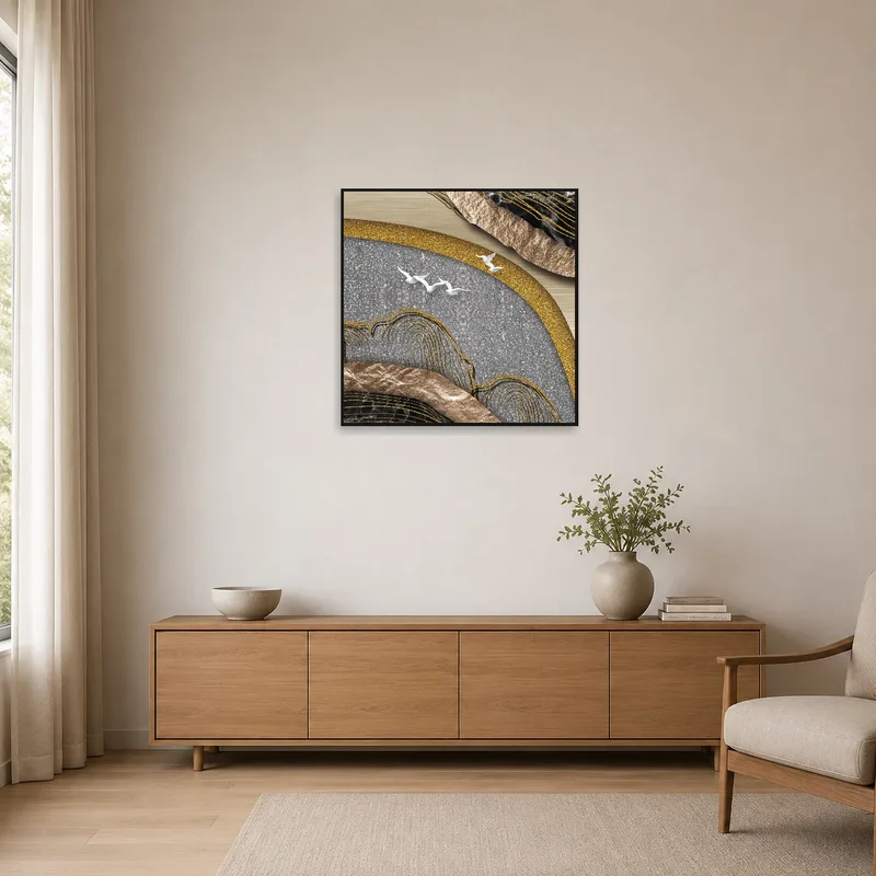 Artwork with metallic textures adding contrast to a minimalist room with sleek furnishings.