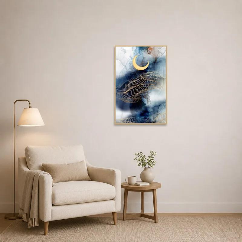 Abstract moon art adding interest to a peaceful reading corner with a plush chair.
