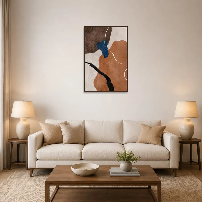Modern earth-toned geometric canvas art on a living room wall.
