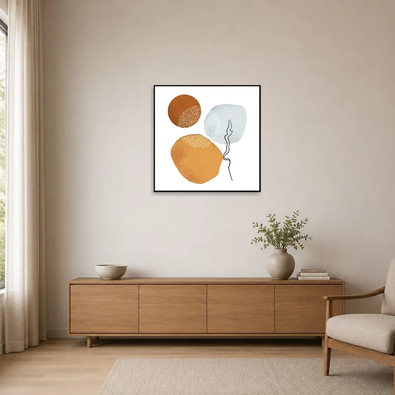 Minimalist circle art in earth tones enhancing a simple, clean space.