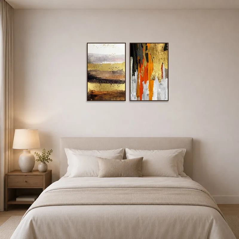 Abstract earth tones art print set adding warmth to a serene bedroom.