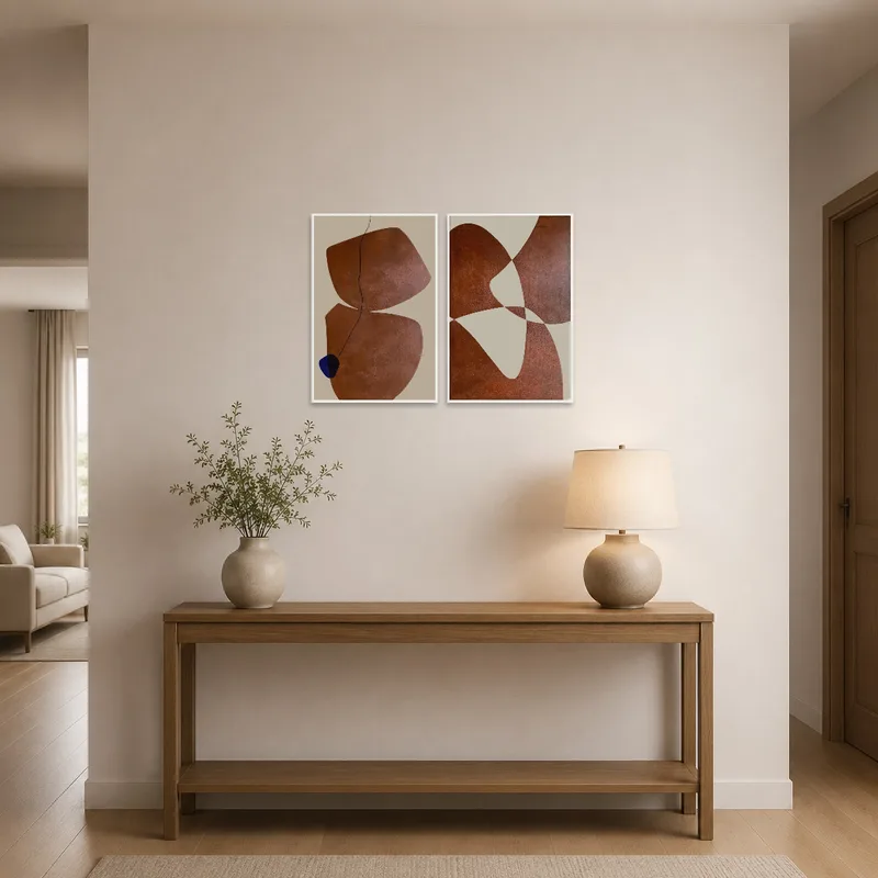 Earthy triptych art welcoming guests in the entrance hall with its calming palette.