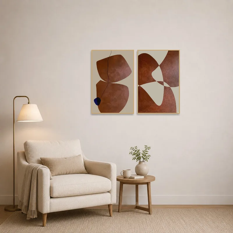 Abstract art set with earth tones creates a serene vibe in a cozy reading corner.