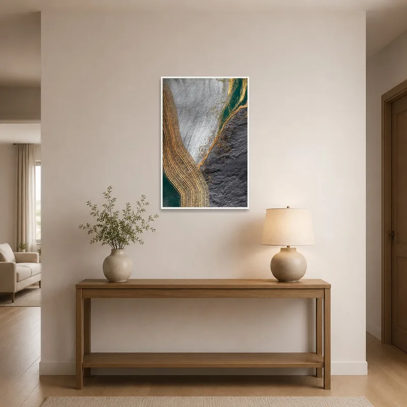 Entrance hall displaying an abstract piece with earthy tones and metallic accents.
