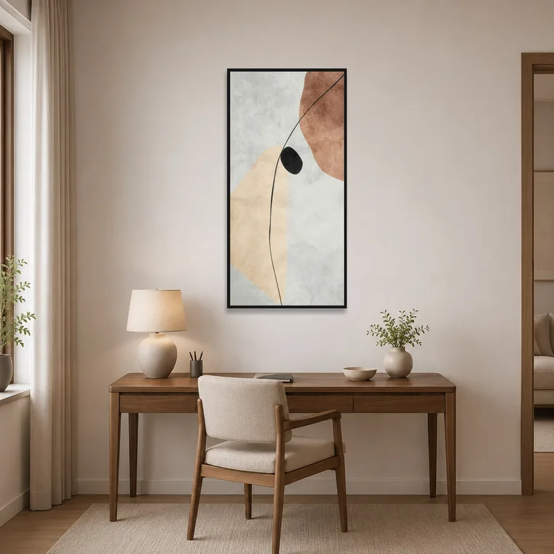 Home office wall adorned with abstract art in earthy tones, featuring a black accent.