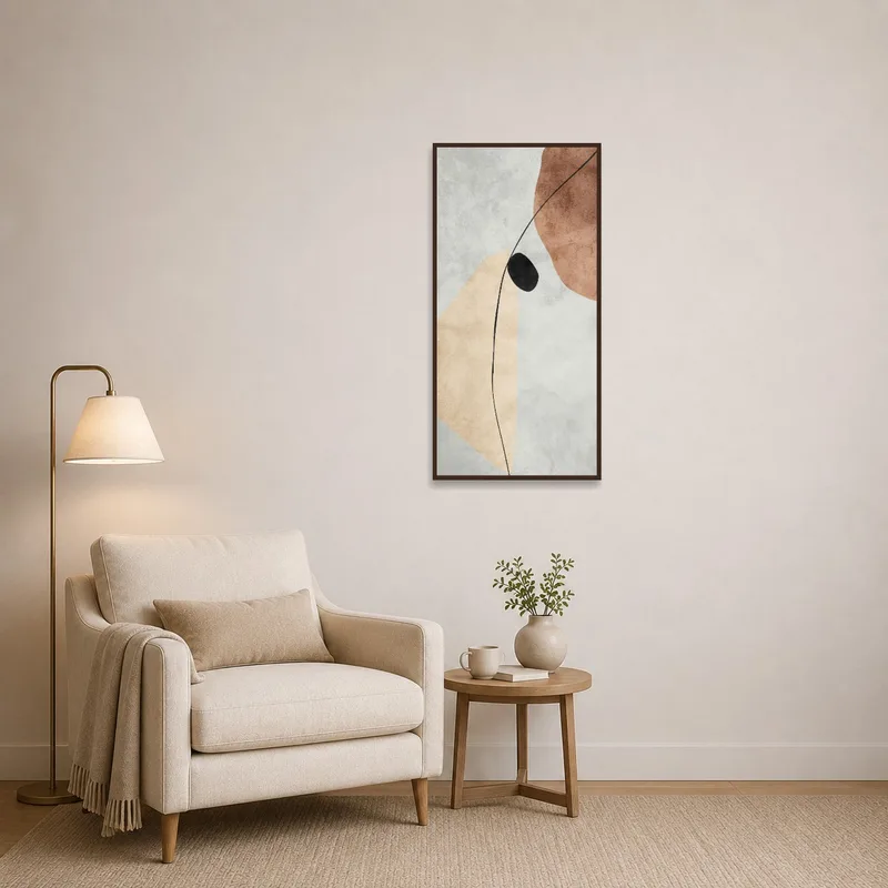 Abstract art with earthy tones and black accent adding interest to a reading corner wall.