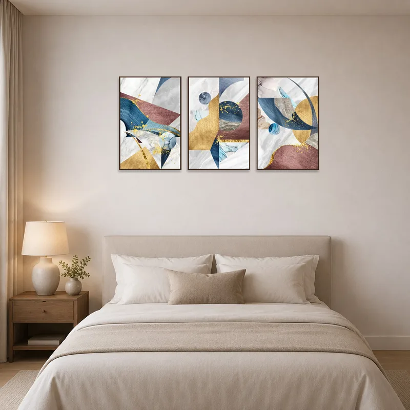 Triptych adds elegance to a serene bedroom setting.