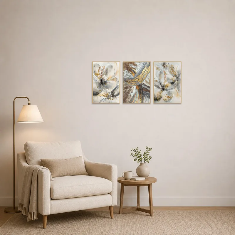 Reading corner adorned with abstract floral and geometric canvas set complementing a comfy chair.