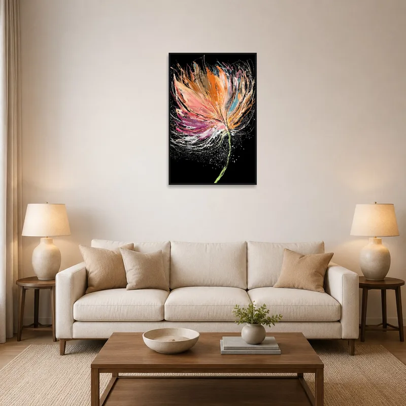 Abstract floral art on a black background adorns a living room wall above a modern sofa.