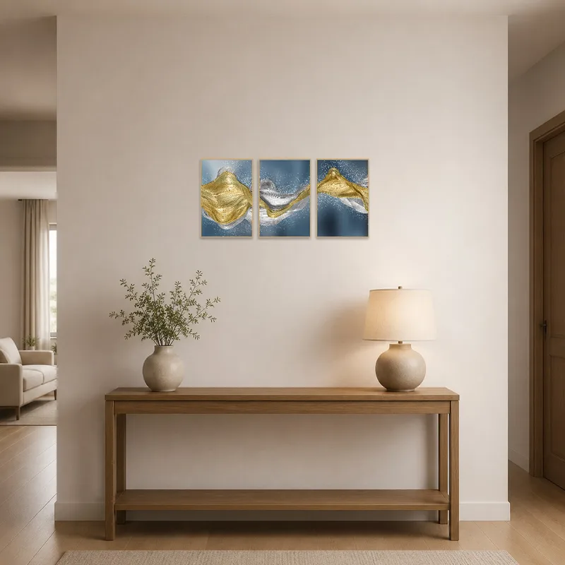 Flowing abstract triptych welcomes guests with a burst of gold and silver in the entrance hall.