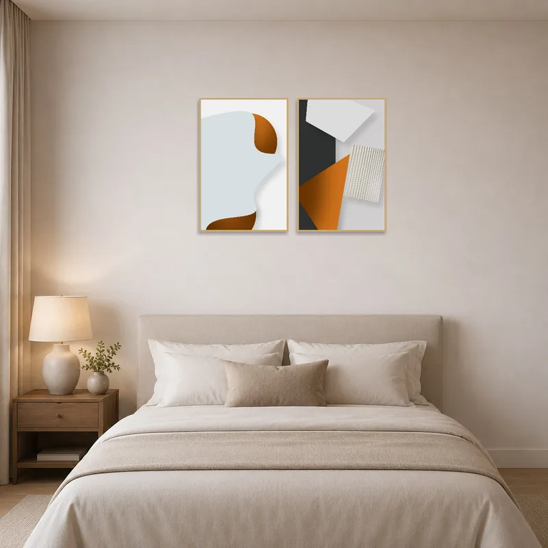 Modern geometric art set hung above the bed in a stylish bedroom.