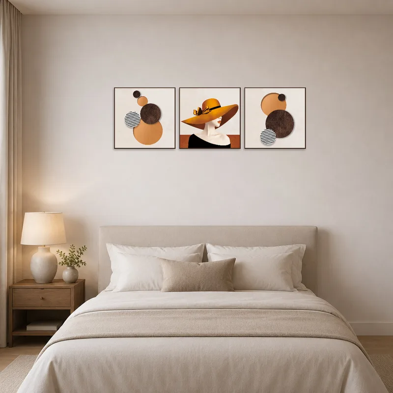 Retro triptych centered on hats and shapes enhances the ambiance above a serene bed.