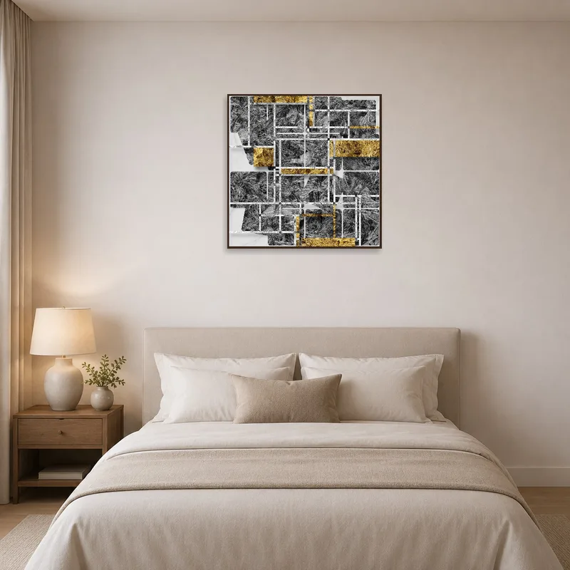 Bedroom wall enhanced by an abstract geometric art print in gold and gray tones.