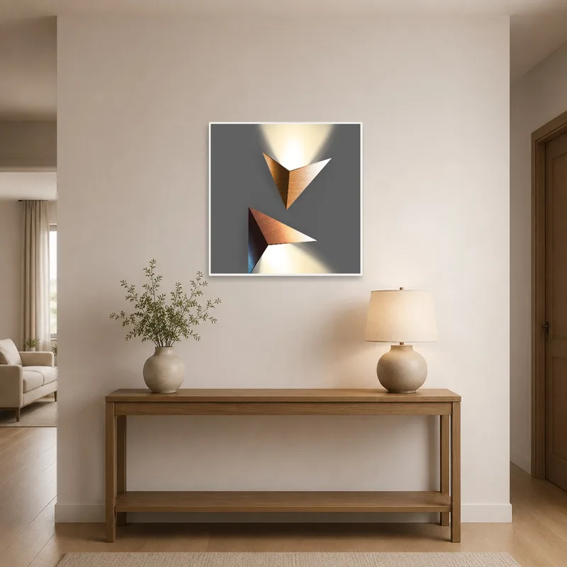 Entryway enhanced by geometric art next to doorway.