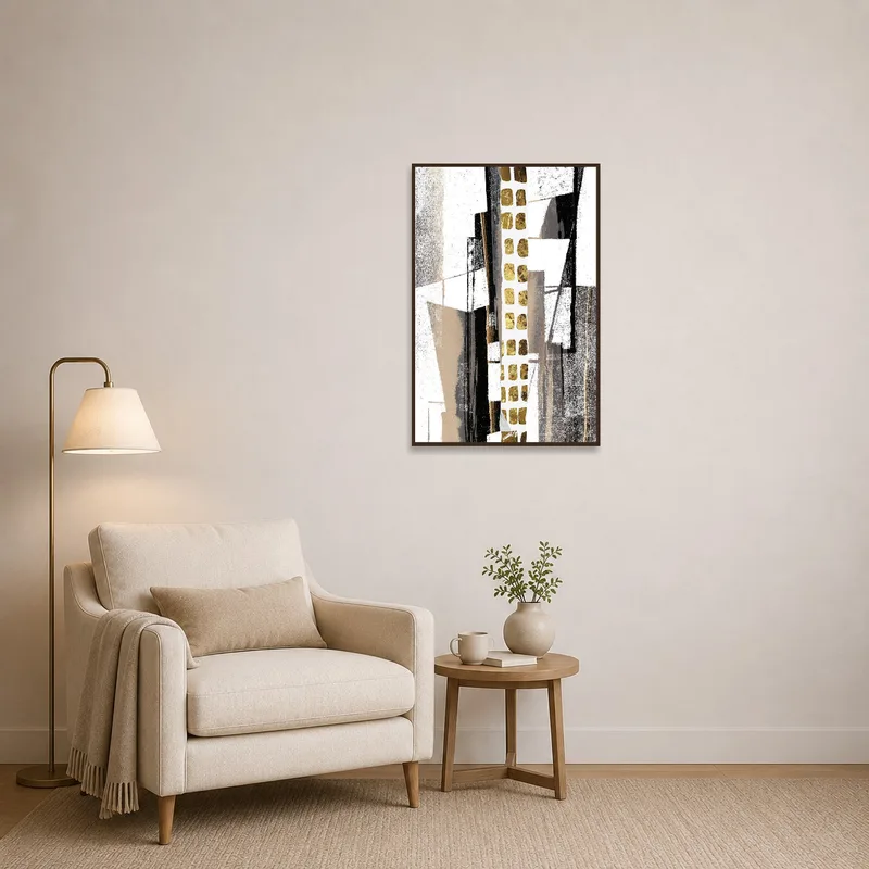 Gold-accented geometric art beside a cozy armchair in a reading corner.