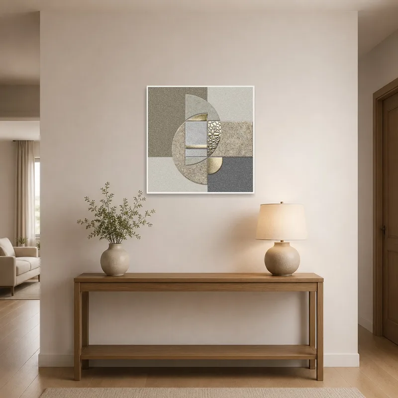A vibrant abstract geometric piece with metallic shine greets visitors in an entrance hall.