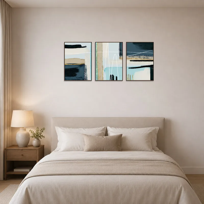 Calming blue and gold geometric triptych elevates the bedroom ambiance.