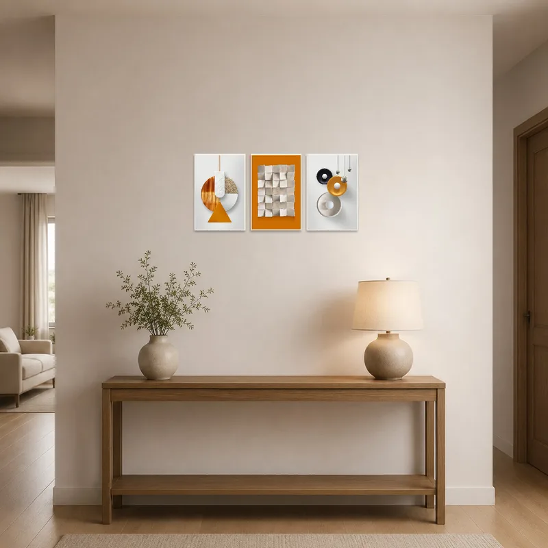 Earthy tone triptych welcomes guests in a stylish entrance hall.