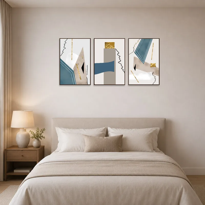 Bedroom featuring an abstract geometric triptych with gold touches.