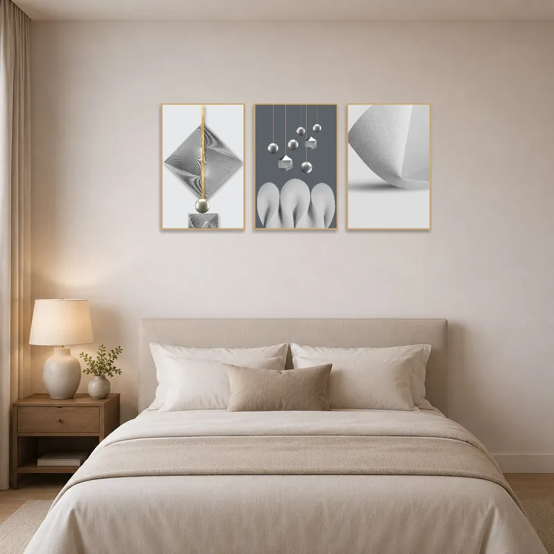 Metallic-accented geometric triptych above the bed in a serene and modern bedroom.