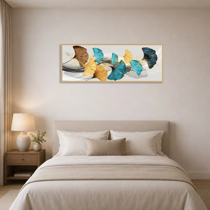 Bedroom wall adorned with abstract ginkgo leaf art in calming blue and gold tones.