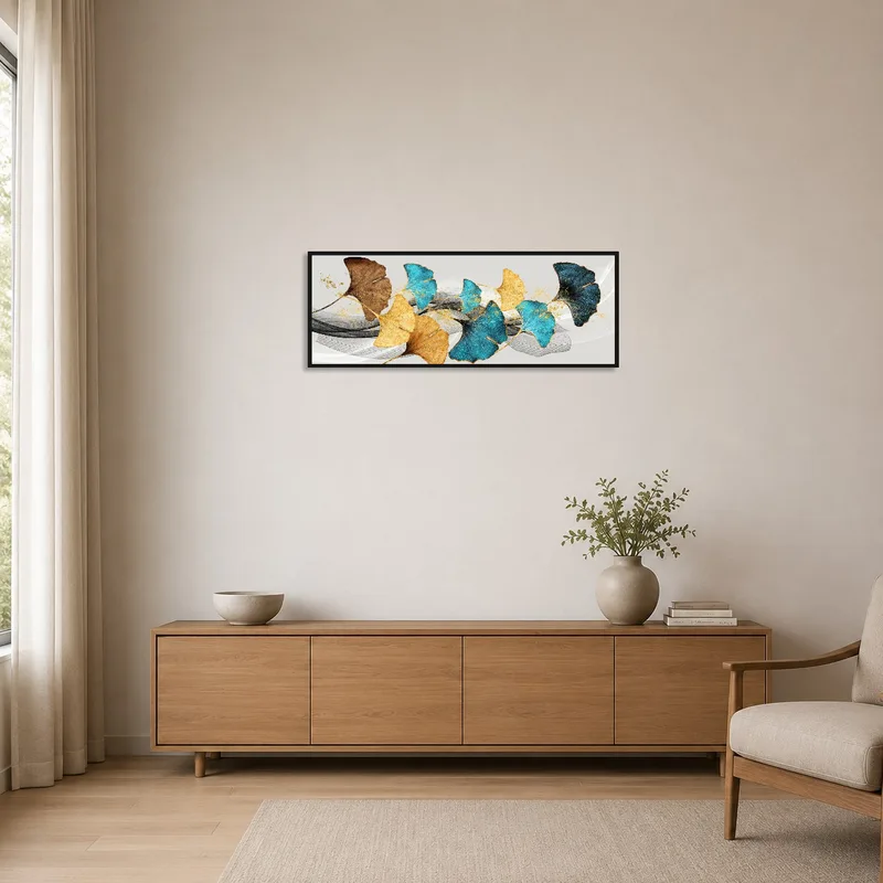 Minimalist room with abstract ginkgo leaf art in blue and gold as the focal point.