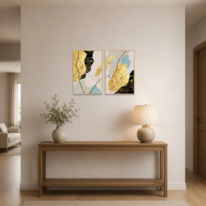 Eye-catching abstract gold and black art set welcoming guests in an elegant entrance hall.