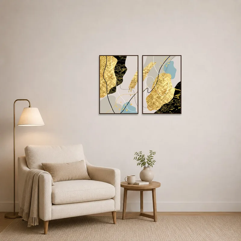 Cozy reading corner enhanced by abstract gold and black art creating a soothing ambiance.