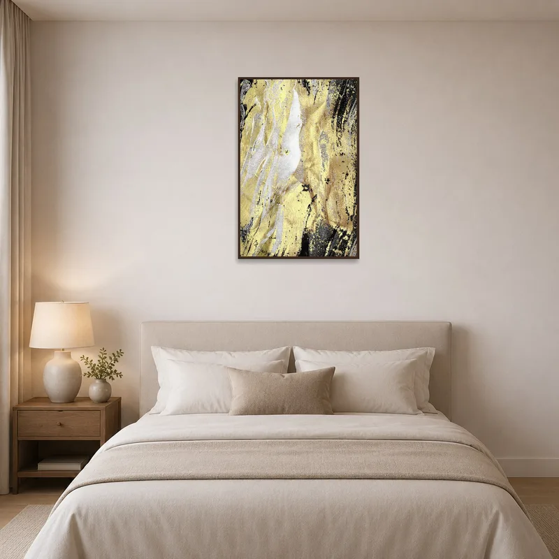 Abstract gold and black artwork providing elegance to a calm bedroom.