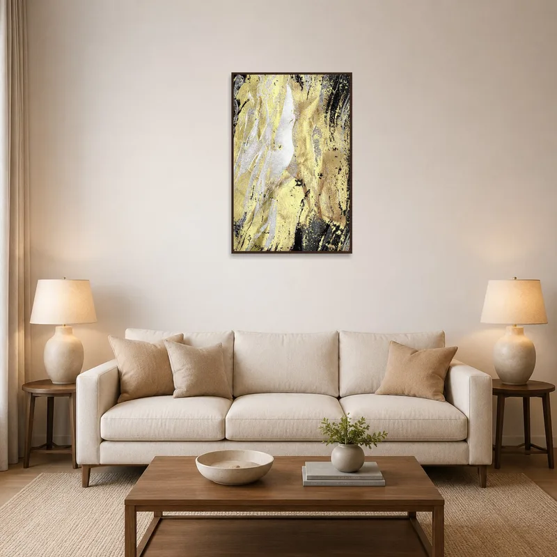 Abstract gold and black textured artwork hanging in a modern living room setting.