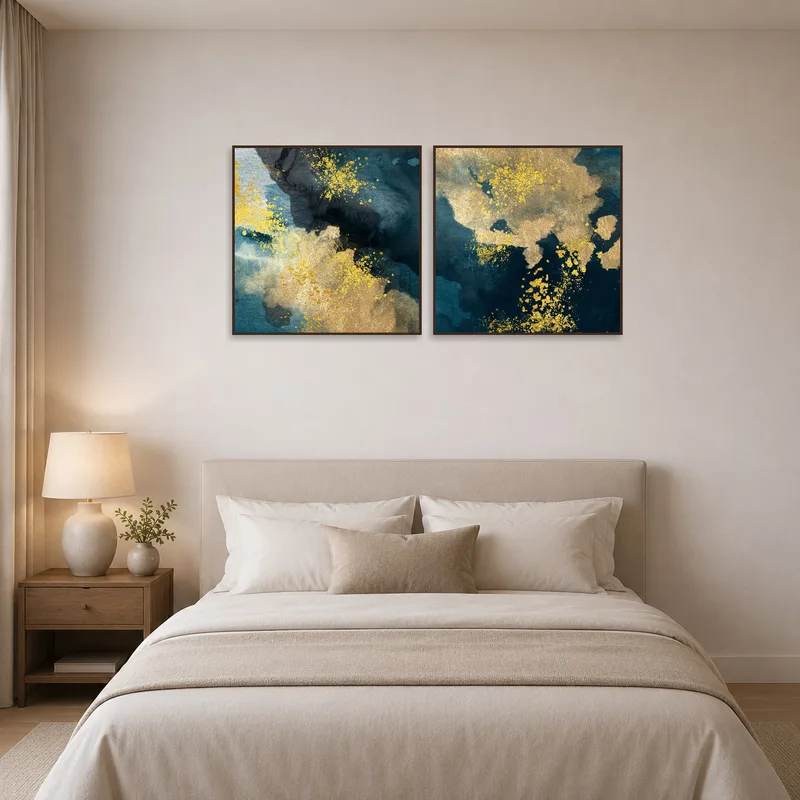 Elegant bedroom wall showcasing abstract art in gold and blue tones.