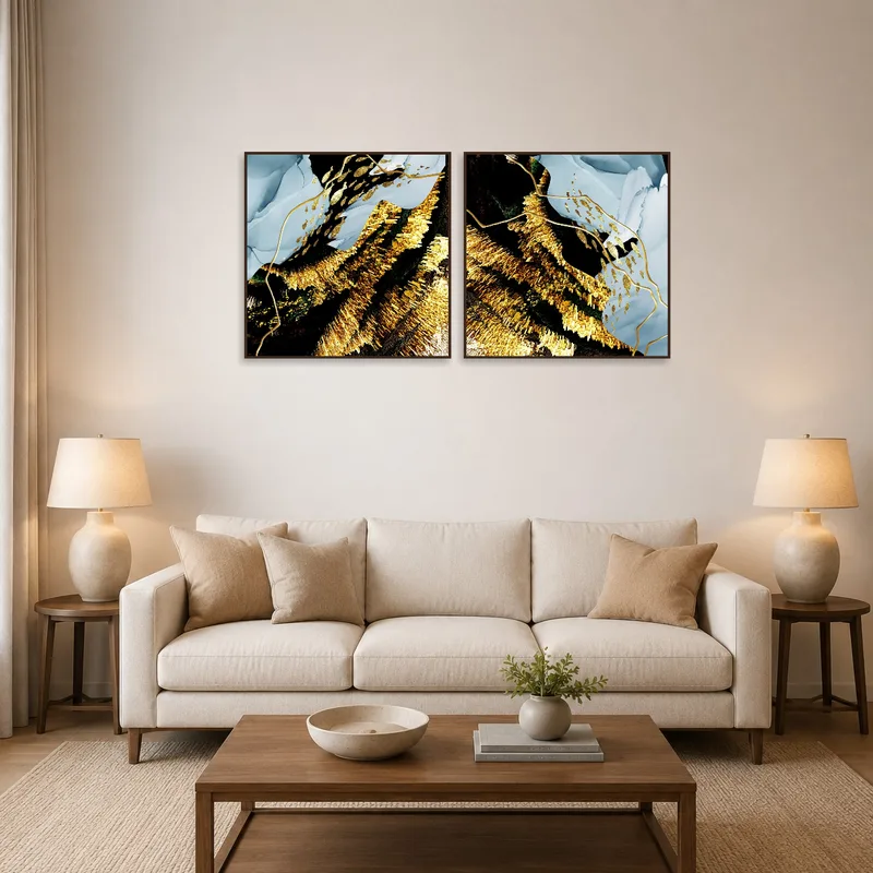 Abstract gold and blue textures add elegance to a living room wall.