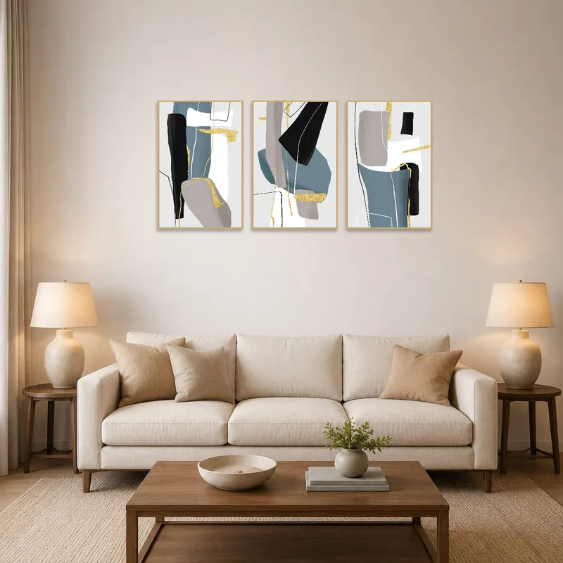 Gold and blue abstract triptych set brightens a modern living room wall.