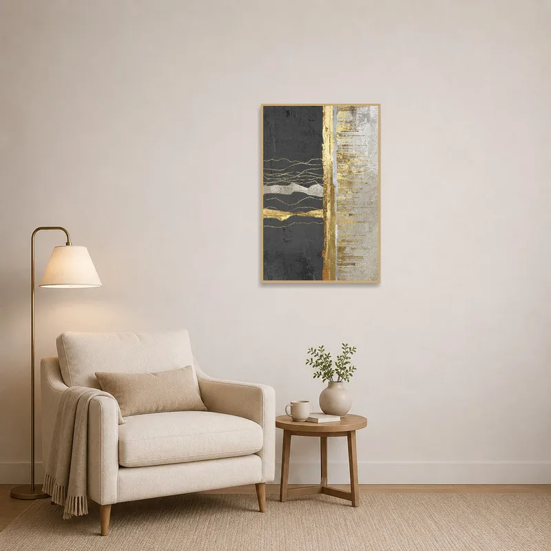 Cozy reading corner adorned with an abstract gold and charcoal piece.