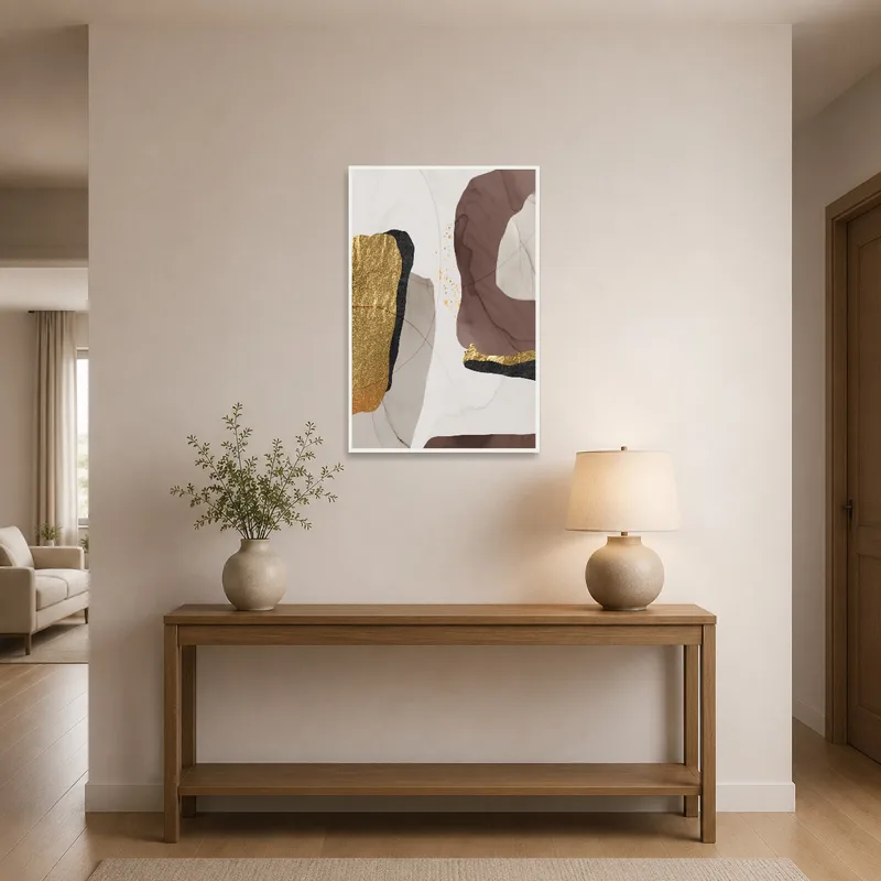 Entrance hall featuring an abstract piece with gold and earthy tones welcoming guests.