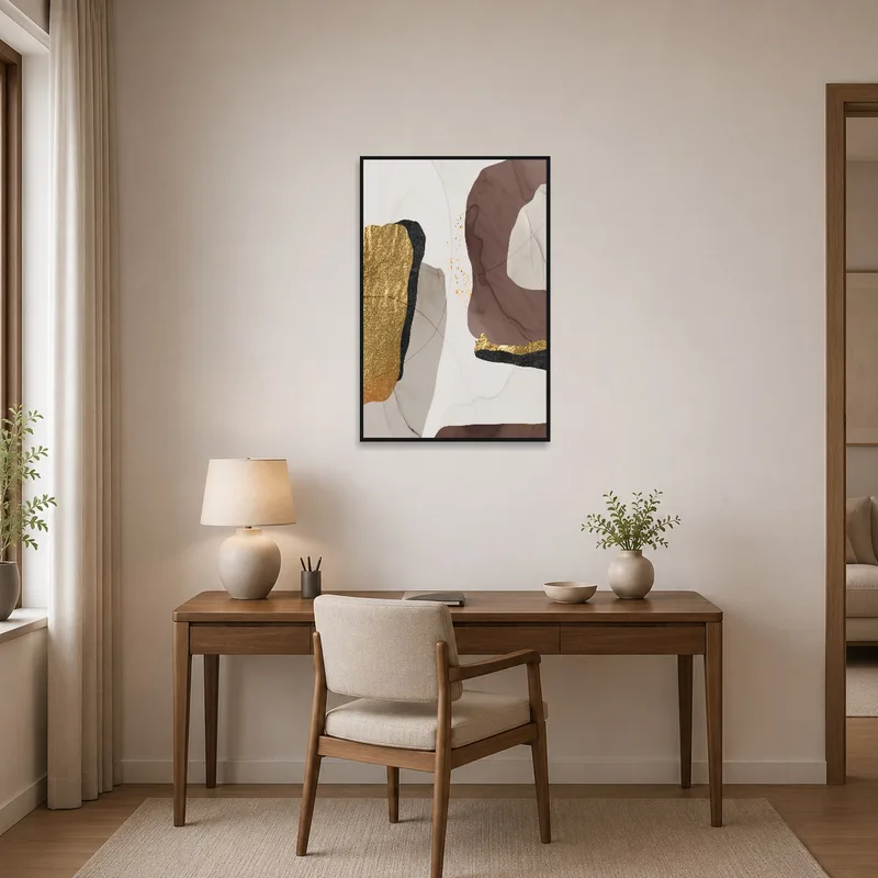 Home office featuring abstract art in gold and earthy shades for an inspiring atmosphere.